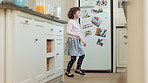 Balance, dance and energy with girl in kitchen of home for expression, rhythm or spin movement. Ballet, development and music with dancer child in apartment for growth, morning fun or practice