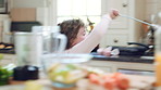 Dance, child and playing with magic wand in home for creative imagination, cookie spell and fun. Energy, happy girl or fantasy toy in kitchen with fun movement, pretend wizard or cake for development