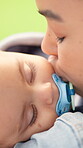 Sleeping, kiss and baby with mother outdoor for support, love and early childhood development. Care, comfort and infant kid with mom for afternoon nap with dream, safety and bonding in nature.