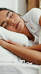 Comfortable, dreaming and sleeping with woman in bed for recovery, relax or rest on weekend. Break, napping and pillow with happy person asleep in bedroom of home for pause, recharge or unwind