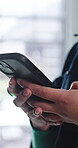 Texting, online and hands with phone in office, communication and chat with contact on social media. Typing, message and employee with internet connection, network and person with mobile in business