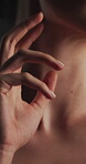 Bodycare, hands and neck of woman in studio for smooth skin, feminine beauty and hydration. Closeup, dermatology and person with soft texture on dark background for body glow, touch and self care