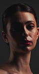 Beauty, confident and face of woman in studio for cosmetics, dermatology or makeover results. Aesthetic, makeup and serious with person on dark background for cosmetology benefits, glowing or shine