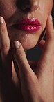 Beauty, touch and mouth with lip care in studio for cosmetics, gloss and makeup for shine. Closeup, pink lipstick and wellness of person with cosmetology, soft texture and pigmentation or manicure