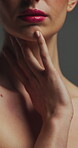 Beauty, touch and skincare with lip gloss in studio for cosmetics, self care and makeup for shine. Manicure, pink lipstick and body wellness of person with cosmetology, soft texture and pigmentation