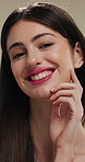 Face, makeup and happy woman with pride for beauty cosmetics or skincare on a studio background. Portrait, female person or smile with lip gloss, glow up or shine for spa, salon or facial treatment