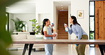 Mother, girl and cleaning with singing, dancing and happy for bonding, hygiene, and spray bottle. People, mom and child in living room for sanitation, karaoke or smile with love in family house