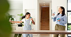 Mother, girl and cleaning with singing in home with dance, happy or bonding with spray bottle for hygiene. People, mom and child in lounge with sanitation, karaoke and play with love at family house