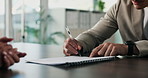 Business, hands or document signature in office for hiring agreement and recruitment. Employee, professional recruiter and people writing on paper for job offer, contract or company policy in meeting