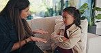 Argument, mom or girl on couch with scolding, teaching moment or frustrated parent in conflict. Anger, mother or child in house with arms crossed, discipline or shouting in behavioural correction.