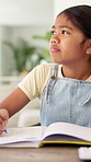 Study, thinking and child with writing homework for math assessment, equation solution or growth. Student, kid or numeracy assignment in house for problem solving, sum answer or academic development