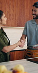 Handshake, tablet and plumber with woman in kitchen for service, agreement or upgrade quote. Happy, repair and handyman shaking hands with client for digital invoice, insurance or home maintenance