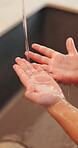 Health, water or kid in home with hand washing, bacteria prevention or wellness routine in childcare. Safety, stream or child with faucet, germ protection or hygiene habit in childhood development.