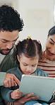 Family, talk and child with tablet in lounge, subscription and watching educational movie on website. Parents, scroll and bonding with kid in home, elearning and people with technology for knowledge