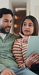 Couple, online and talk with tablet in lounge, smile and planning for home improvement or renovation. Happy people, discussion and remodeling ideas with tech, point and research on website in house