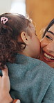 Mother, child and hug in home with kiss, maternal connection and love for bonding together on weekend. Happy family, woman and toddler daughter embrace in house with support, affection and trust.