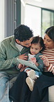 Happy family, bonding and girl with tablet for online games, love and entertainment in home. Father, mother and daughter with digital tech for cartoon, streaming or app subscription on sofa in house