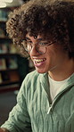 Student, man and excited in library with laptop, college education success or pass mark for assessment. Happy, person and test results in university with computer, learning goals or award achievement