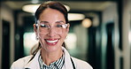 Face, woman and doctor with pride for healthcare, confidence and wellness career in hallway. Smile, physician or mature professional with portrait for about us, management and support in clinic