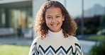 Happy, smile and face of child in backyard for positive attitude, development and relax outdoor. Neighborhood, family and portrait of girl with good mood for holiday, break and fresh air on weekend