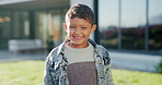 Happy, laugh and face of child in backyard for positive attitude, development and relax outdoor. Neighborhood, smile and portrait of boy with good mood for holiday, break and fresh air on weekend
