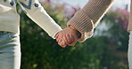 People, mom and holding hands with child in nature for motherhood, parenting or outdoor care. Mother, kid or daughter with love, trust or commitment for protection, safety or security in garden