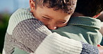 Love, hug and child with dad in garden for bonding, loving relationship and security for development. Family, outdoor and boy with father in embrace for affection, support and connection for trust