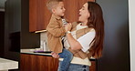 Dance, love and mother with toddler in kitchen for happy, celebration and bonding. Playful, movement and music with woman and child in family home for support, weekend and hug for entertainment