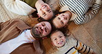 Parents, children and above with face in home, smile and bonding with love, laying and relax on floor. Happy people, mom and dad in morning, portrait or kids on carpet for connection at family house