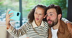 Goofy, father and child with selfie at house for photography, social media and family blog. Silly, man or embrace daughter for affection, profile picture update and capture moment of funny expression