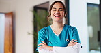 Crossed arms, happy and face of nurse in hospital with confidence for medical career with service. Laugh, professional and portrait of female healthcare worker with pride for about us in clinic.
