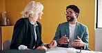 Feedback, laughing and meeting with business people in office together for development or training. Explain, funny and review with woman speaking to man in workplace for communication, plan or report