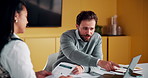 Explain, laptop and meeting with business people in office for development or discussion. Collaboration, computer and documents with man speaking to woman in workplace for feedback, report or review