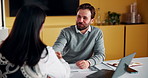 Laptop, handshake and business people in office with documents for finance deal or agreement. Paperwork, computer and financial manager shaking hands with investor for investment contract in meeting.