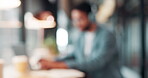 Blurred, business person and typing in cafe with remote worker, headphones and laptop with workflow. Man, bokeh space or writing report with tech, out of office or hybrid work with audio in bistro
