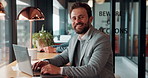 Face, laptop and happy man in cafe for remote work, confidence or financial accountant with pride. Computer, smile and person in coffee shop for freelance business, bookkeeping and audit review