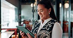 Business woman, tablet and reading in cafe with smile, scroll customer review or blog for online humor. Female owner, restaurant forum or platform with positive feedback, social media and tech