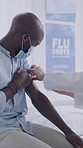 Injection, consultation and doctor with man in clinic for flu shot, treatment or vaccination. Checkup, needle and hands of healthcare worker with male patient for medical syringe for medication.