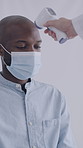 Man, doctor and thermometer with face mask at clinic with document, reading and hantavirus assessment. People, medical professional and patient with equipment, paperwork and ppe for virus at hospital