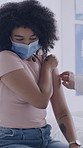 Injection, consultation and doctor with woman in clinic for flu shot, treatment or vaccination. Face mask, needle and hands of healthcare worker with female patient for medical syringe for medication