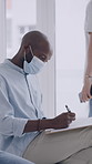 Person, writing and clipboard in waiting room for doctor, medical consultation and mask for virus. Man, paperwork or health insurance in clinic with appointment, people and PPE for infection control.