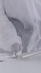 Person, hands and cleaning keyboard with hazmat suit for disinfection, hygiene or viral protection. Pandemic, epidemic or wiping surface with tech for airborne virus, bacteria or germ removal on desk