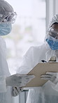 People, scientist and checklist with hazmat suit for pandemic, viral disease or investigation. Group, medical or healthcare professionals with clipboard or face mask for airborne virus or inspection