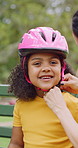 Helmet, safety and face of child with parents in nature on bench for help with equipment for skating. Outdoor, portrait and girl kid with mother and father for gear with teaching security protocol.