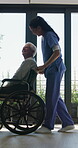 Old man, wheelchair and happy nurse for help, assisted living and support with caregiver. Woman, elderly patient or person with disability in retirement home for medical service, push and window