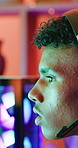 Boy, teenager and gaming with headset in home for video games, live streaming and challenge. Male person, computer and gamer with mic for esport, online competition and content creation of tournament