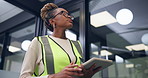 Construction, thinking and black woman on tablet in office for inspection, renovation and report. Reflection, low angle and person on tech for compliance, building assessment or property evaluation