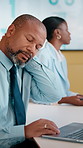 Frustrated, man or neck pain with laptop in meeting for overworked strain or stress in conference. Male person, employee or pressure with computer for bad posture, discomfort or muscle tension