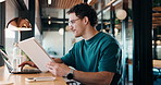 Man, tablet and remote work in restaurant with laptop, review or check software for web design project. Freelancer, happy person or digital designer in cafe with tech, site test or programming update