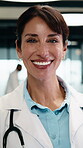 Doctor, face and woman with tablet for healthcare career, about us or service in hospital hallway. Smile, portrait and mature physician on digital tech for medical report, planning or job excellence